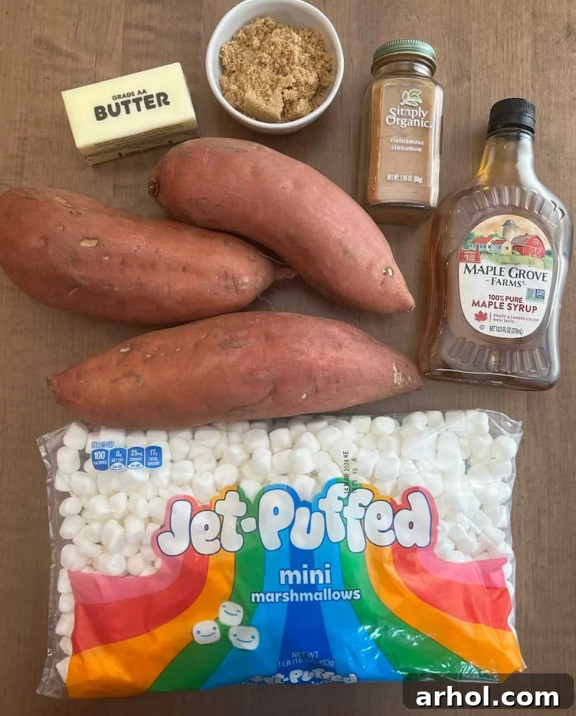 A vibrant selection of fresh sweet potatoes, rich butter, dark brown sugar, fluffy marshmallows, aromatic cinnamon, and golden maple syrup – all the essential ingredients for an unforgettable sweet potato casserole.