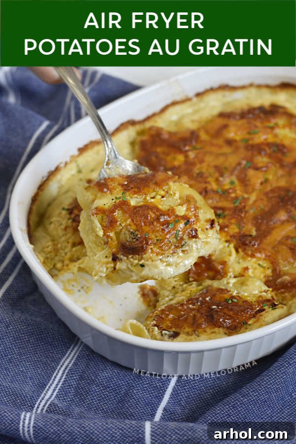 close up of air fryer potatoes au gratn on a serving spoon