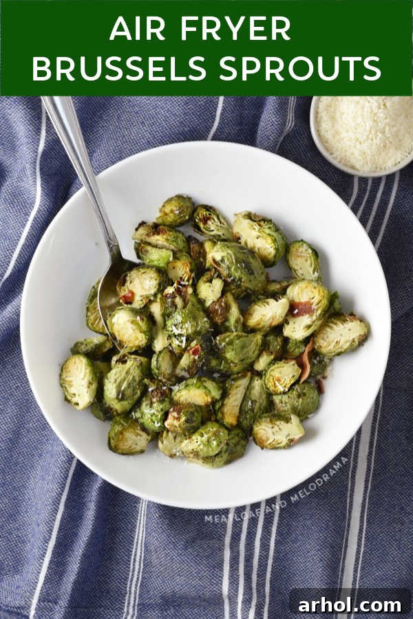 Perfectly Crispy Air Fryer Brussels Sprouts 7 A close-up shot of crispy air-fried Brussels sprouts served in a white bowl, showing their golden brown exterior.