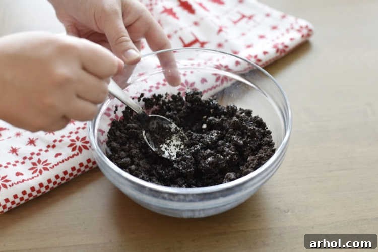 mix butter with crushed oreo cookies in bowl