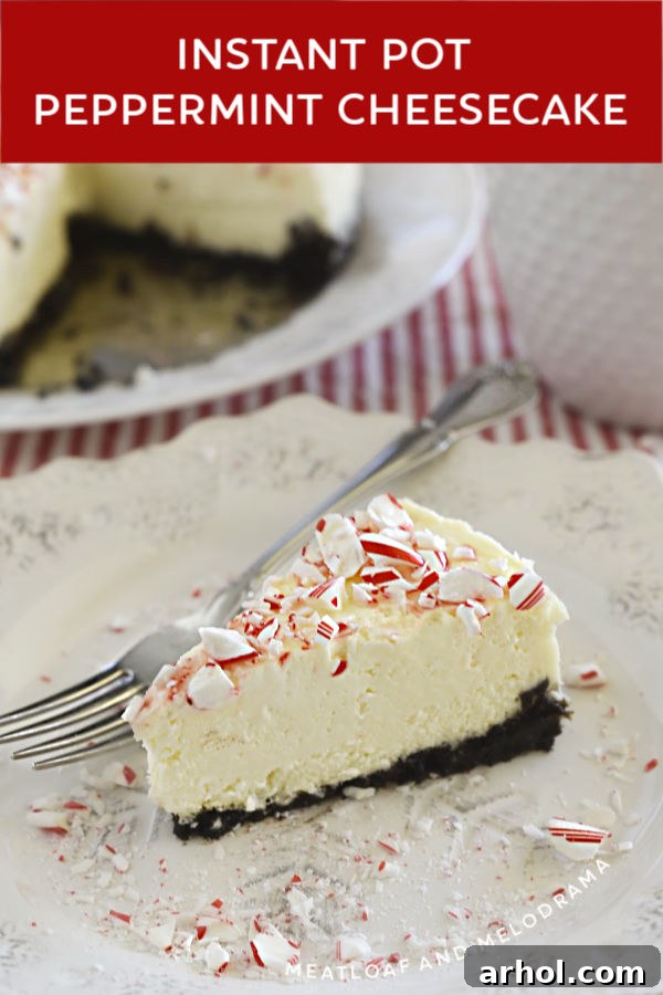 slice of instant pot peppermint cheesecake with oreo cookie crust