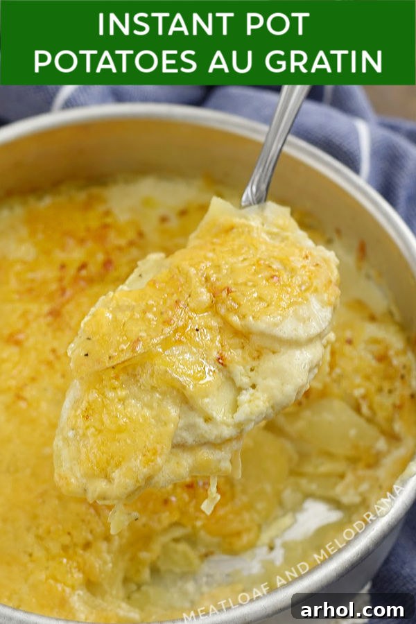 Close up of Instant Pot Potatoes Au Gratin on a serving spoon, highlighting the cheesy layers and rich sauce.