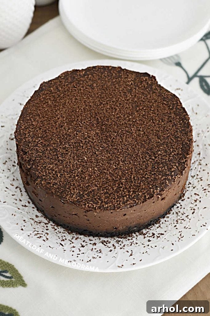 copycat godiva chocolate cheesecake on a white plate