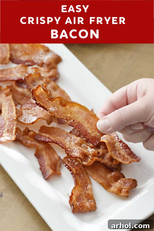 close up of cooked bacon in hand