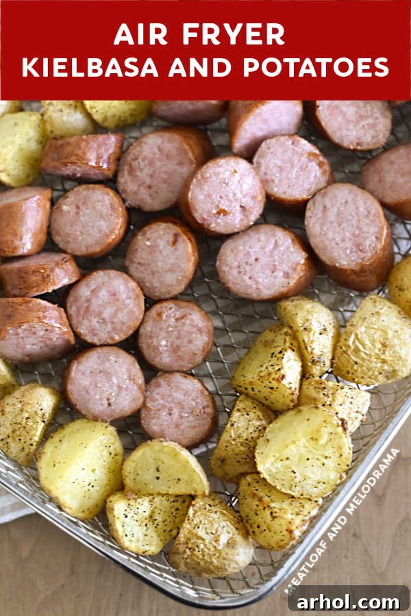 Close-up view of perfectly browned smoked sausage slices and crispy, tender potatoes, fresh from the air fryer and ready to eat.