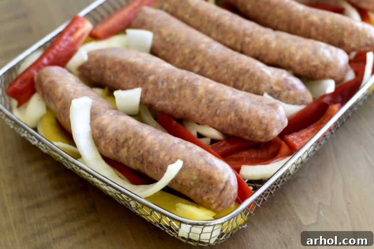 Italian sausage links with sliced onions and bell peppers in omni plus basket