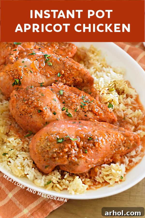 Close-up view of a succulent piece of Instant Pot apricot chicken, showcasing its sweet and sticky glaze.