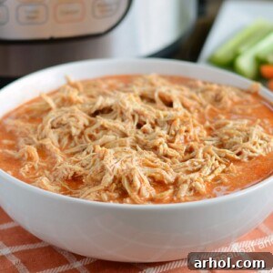 instant pot buffalo chicken recipe shredded in white bowl