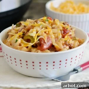 instant pot macaroni beef casserole with cheese in white bowl