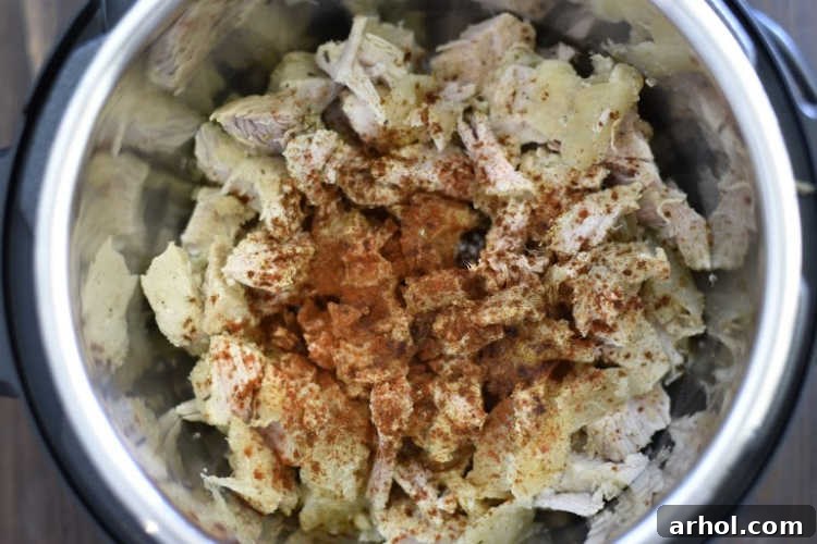 Cubed leftover pork seasoned with ancho chili powder in an Instant Pot