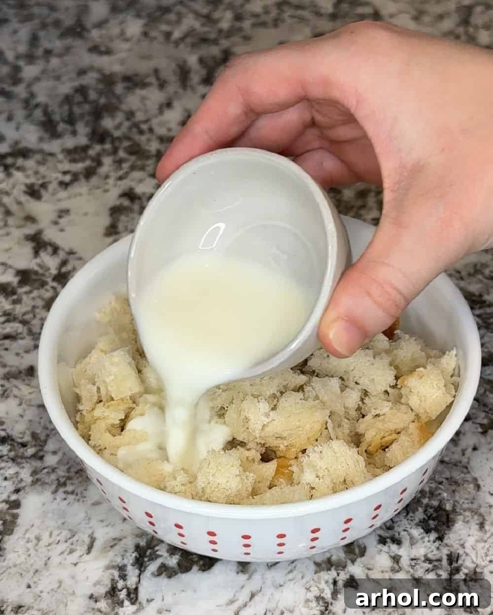 Step 1: Pour milk over torn fresh bread pieces in a bowl to moisten.