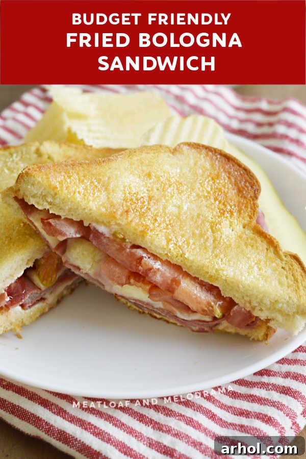 Close-up of the interior of a fried bologna and cheese sandwich, revealing melted cheese and crispy bologna.