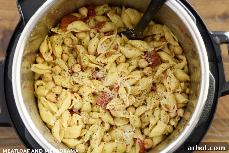 shells with tomatoes and garbanzo beans in the pressure cooker