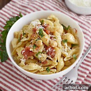 bowl of shell pasta with chickpeas and tomatoes made in Instant Pot