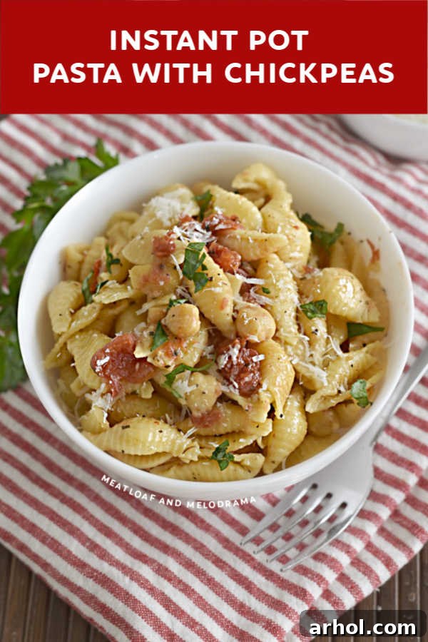close up of pasta and chickpeas in white bowl