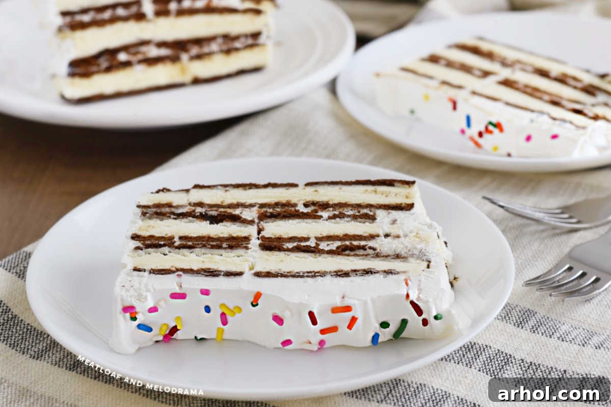 Effortless Ice Cream Sandwich Cake 7 A freshly made Ice Cream Sandwich Cake, sliced and ready to be served on white plates.