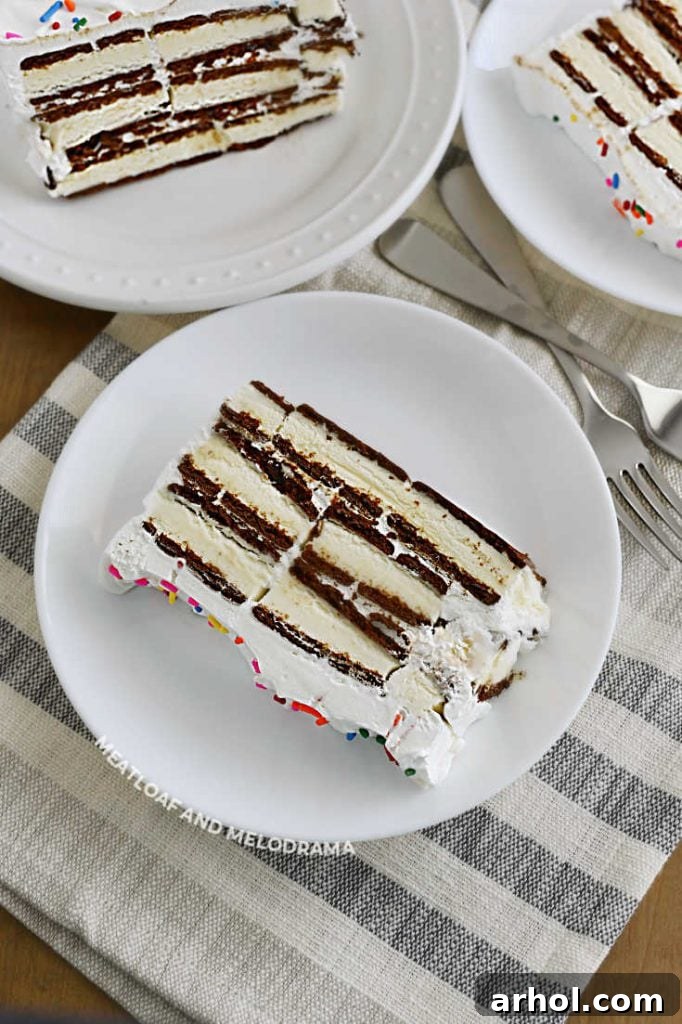 Effortless Ice Cream Sandwich Cake 9 Multiple slices of Ice Cream Sandwich Cake on white plates, showcasing the layered dessert.