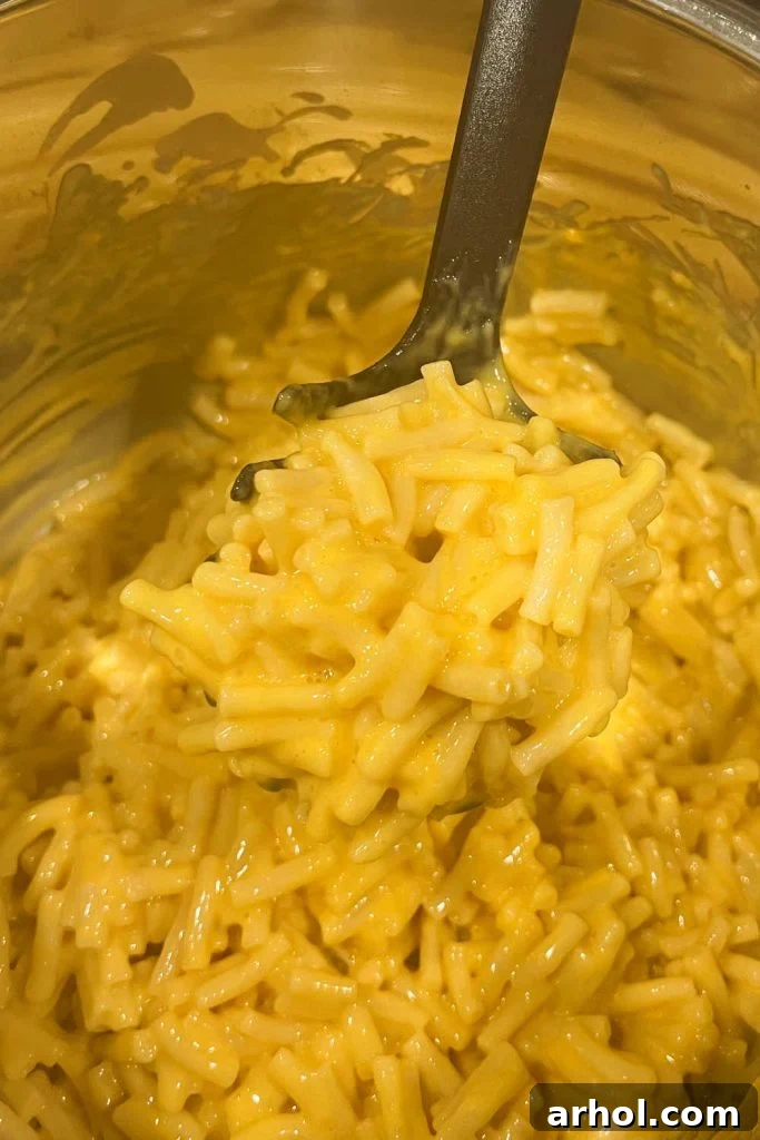 Creamy Instant Pot Kraft Mac and Cheese 6 Creamy boxed mac and cheese mixed in the Instant Pot, ready to serve.