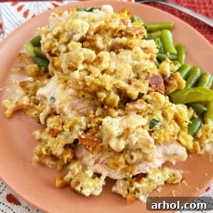 Crockpot chicken and stuffing with green beans on a plate ready to serve