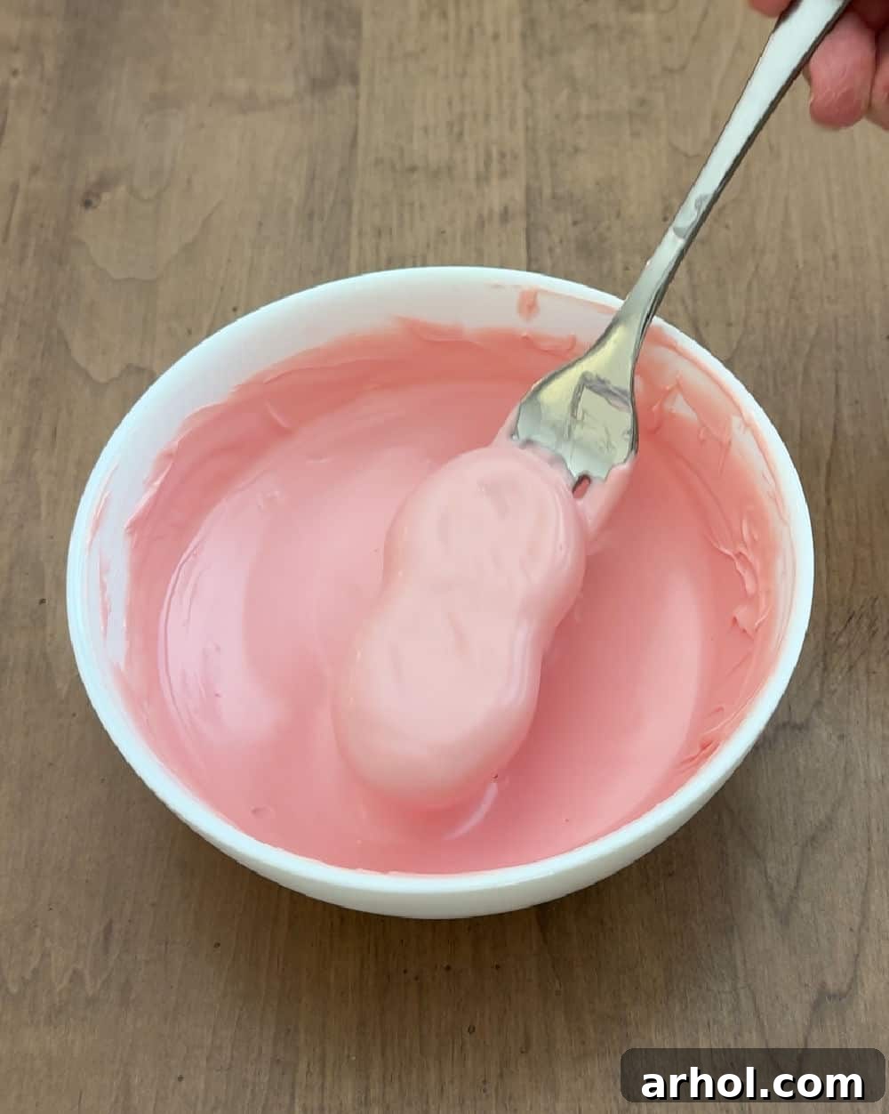 nutter butter cookie dipped in pink candy coating.