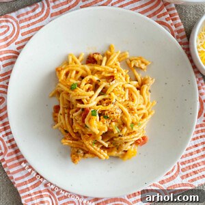 Instant Pot Chicken Spaghetti served on a plate, topped with fresh parsley for garnish.
