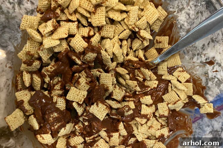 stir rice chex cereal into chocolate peanut butter mixture