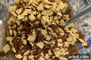 stir rice chex cereal into chocolate peanut butter mixture