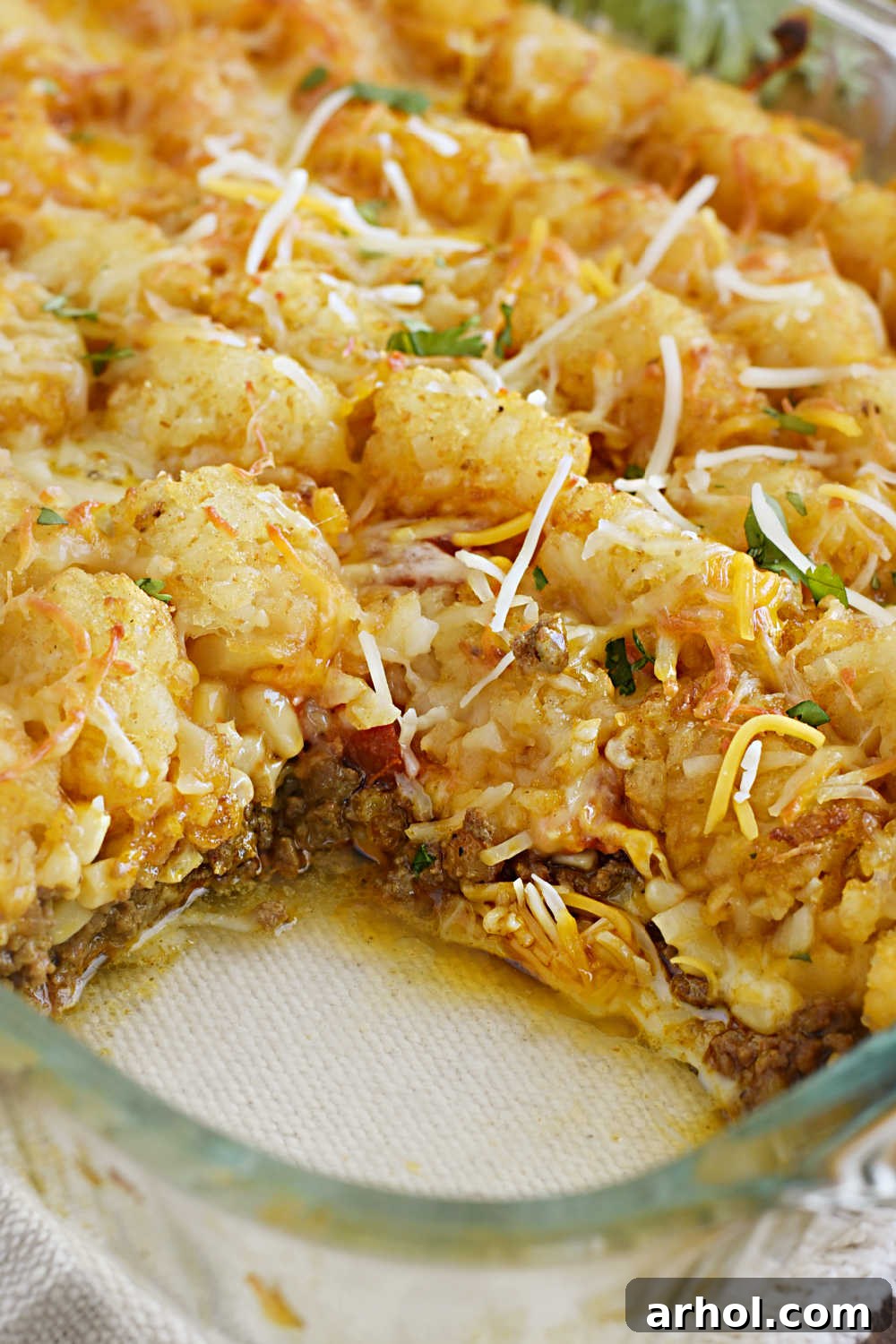Mexican tater tot casserole cut in baking dish