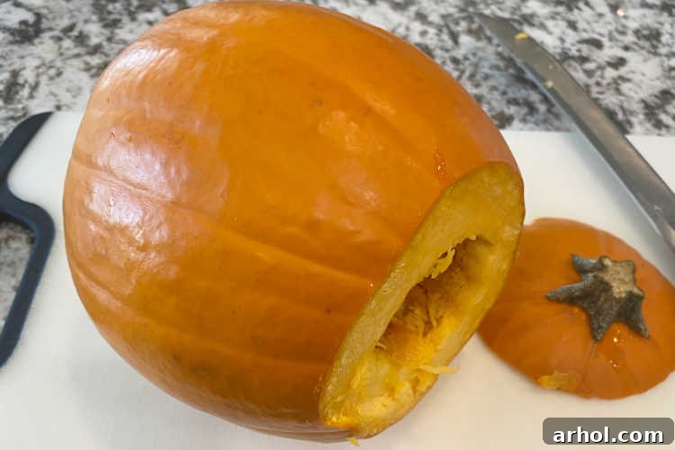 sugar pumpkin with top cut off on the counter