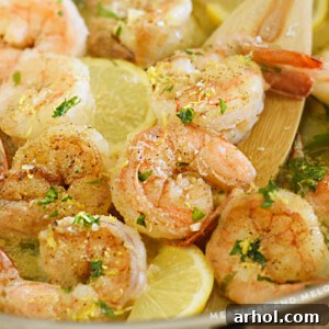 shrimp scampi with lemon and parsley in a skillet