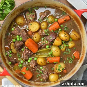 Delicious Dutch oven beef stew with red wine, carrots, and potatoes, ready on the table