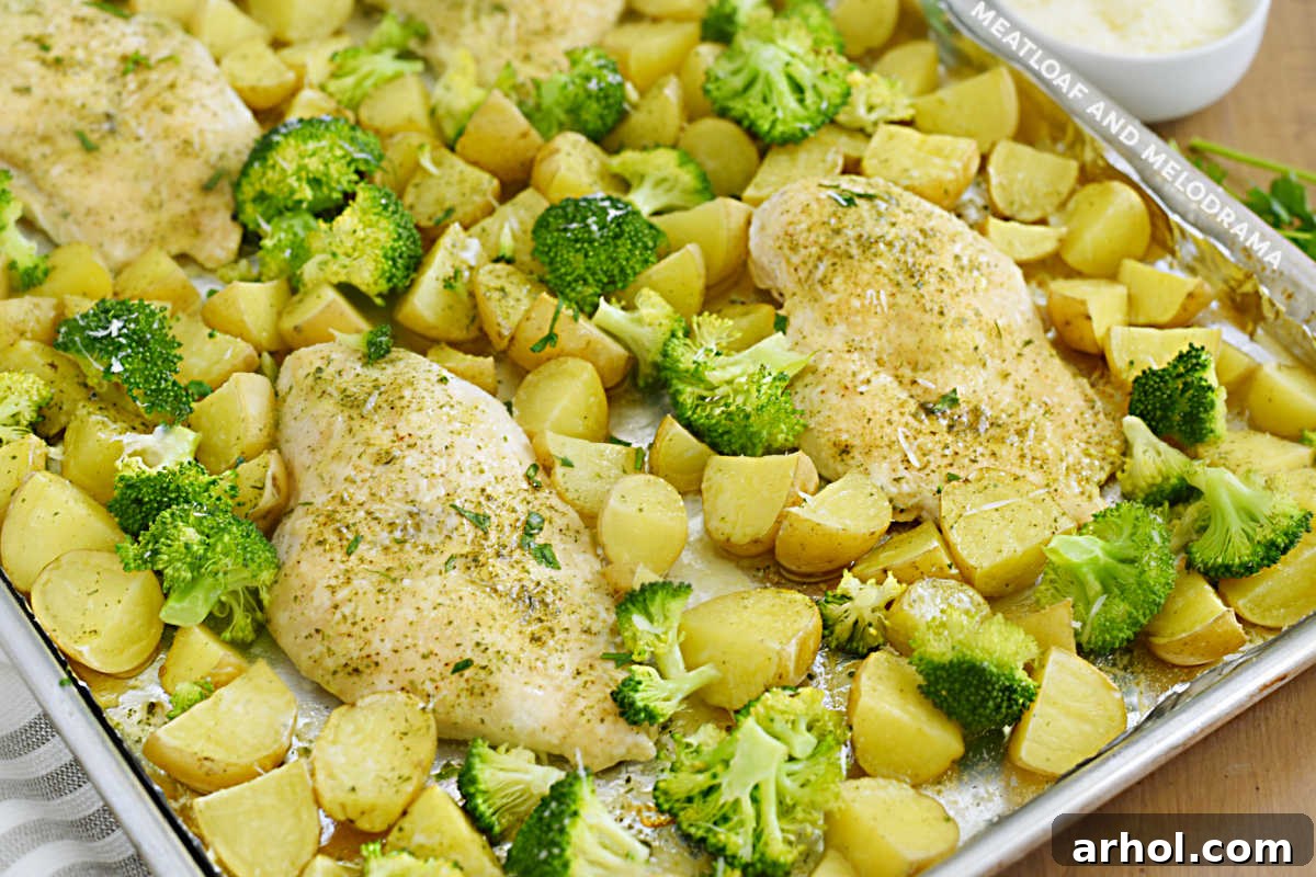 Effortless Ranch Chicken Sheet Pan 5 Delicious baked ranch chicken breasts with tender potatoes and fresh broccoli on a single sheet pan.