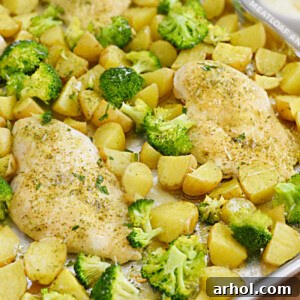 One pan ranch chicken and potatoes with broccoli on sheet pan, a family-friendly meal.