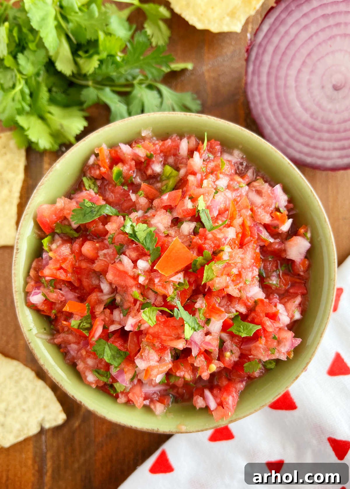 bowl of authentic pico de gallo with red onion and tortilla chips