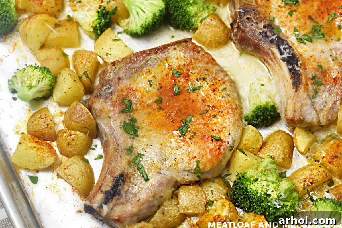 baked bone in ranch pork chops on a sheet pan with potatoes and broccoli