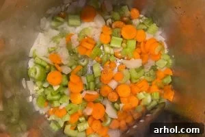 saute chopped onions, carrots and celery in pressure cooker