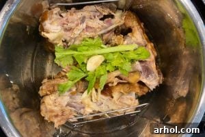 chicken carcass with garlic and celery in instant pot