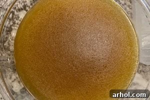 bowl of dark chicken stock