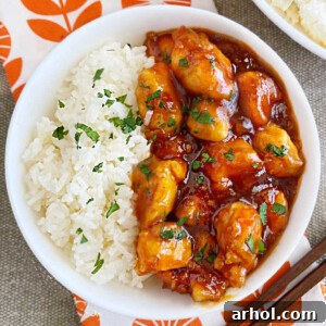 bowl of orange chicken with orange marmalade sauce