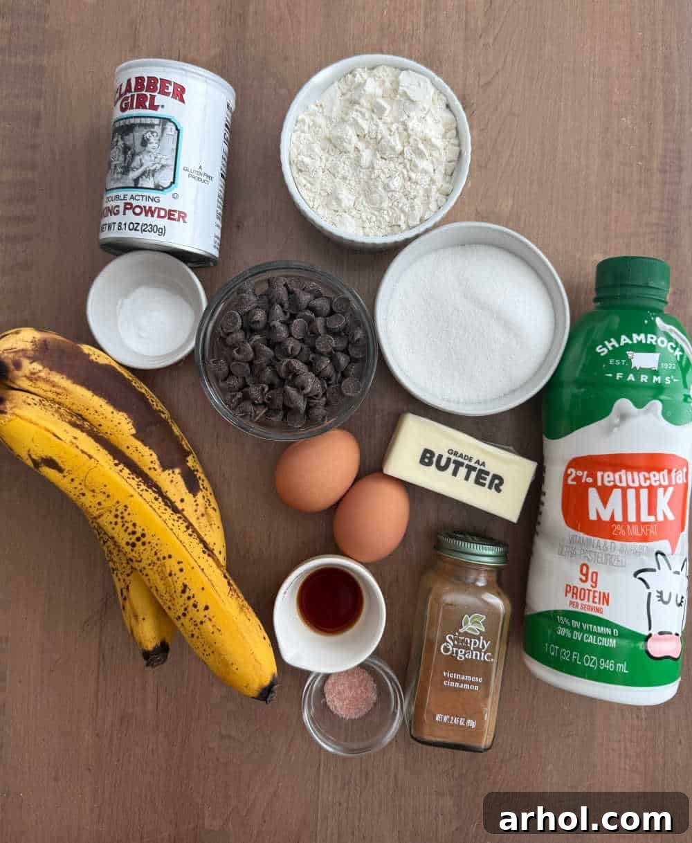 A selection of ripe bananas along with other essential baking ingredients like eggs, flour, and butter, ready for muffin preparation.