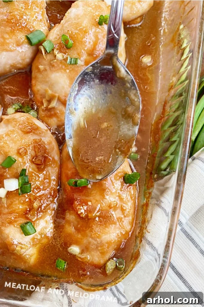 spoon sauce over baked chicken breasts