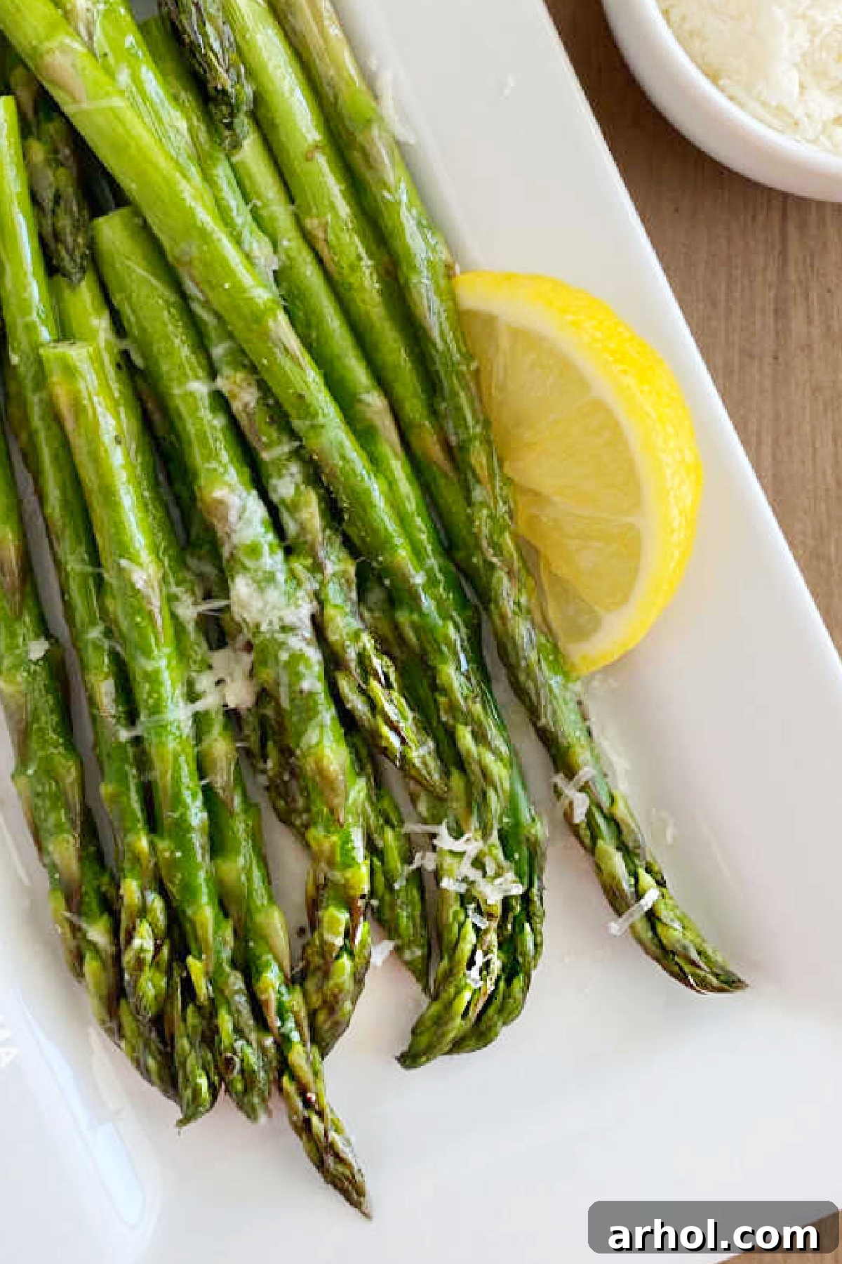 microwave asparagus with Parmesan cheese and lemon on platter