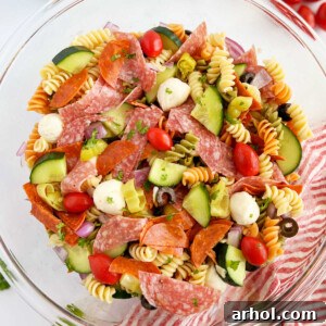 Italian pasta salad with pepperoni, rotini pasta and fresh vegetables in bowl
