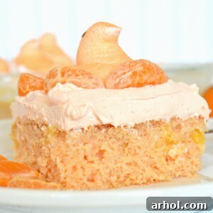 Close-up of Orange Creamsicle Peeps Cake with frosting and garnish