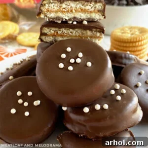 Chocolate Peanut Butter Ritz Cookies with white candy pieces arranged artfully on a plate, ready to be served.