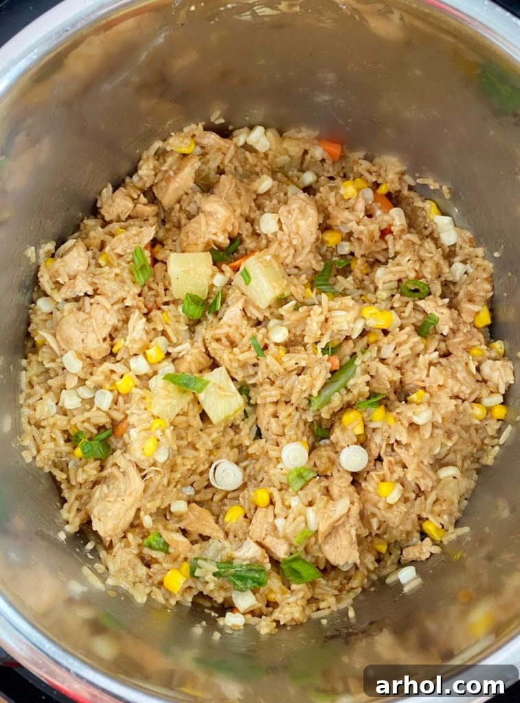 Freshly cooked teriyaki chicken and rice with pineapple and mixed vegetables in the Instant Pot, ready to be served.
