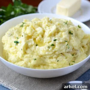 instant pot mashed potatoes with butter in a white bowl