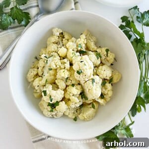 microwave cauliflower in white serving bowl