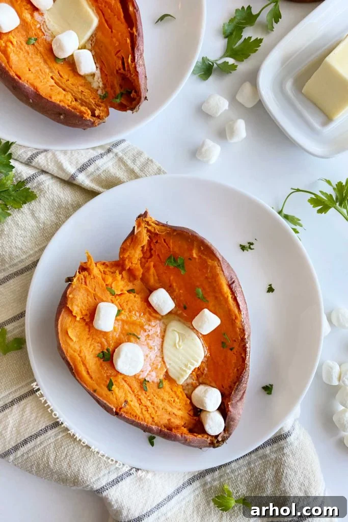 Microwave Sweet Potato in Minutes 7 Cut open sweet potatoes with marshmallows and butter, ready for a sweeter variation