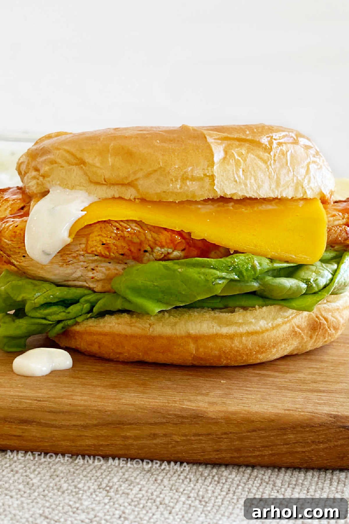 Grilled Buffalo Chicken Sandwich with ranch dressing on a brioche bun, perfect for a Ninja Foodi Grill